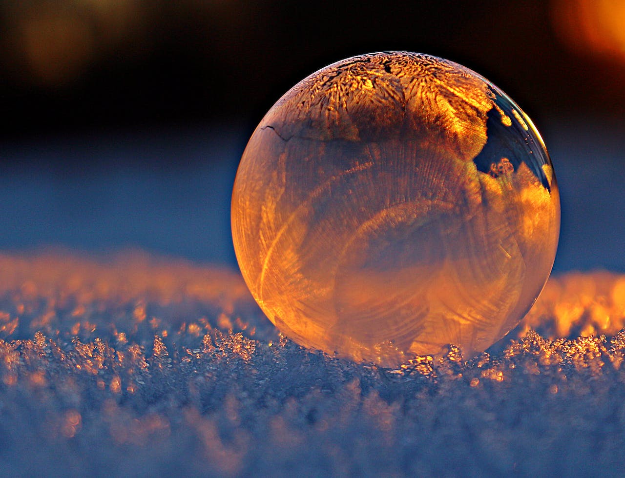 Clear Glass Sphere reflecting glowing ice