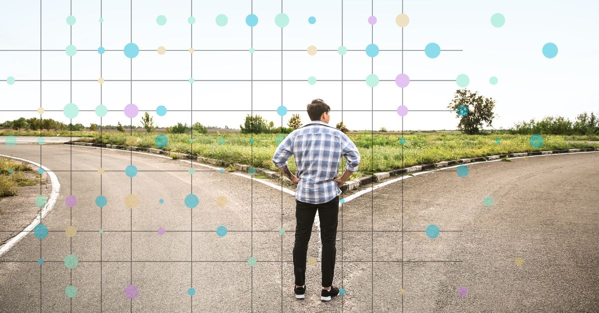 A siloutte of a person standing at a crossroads. Behind them, a grid with colourful data points.